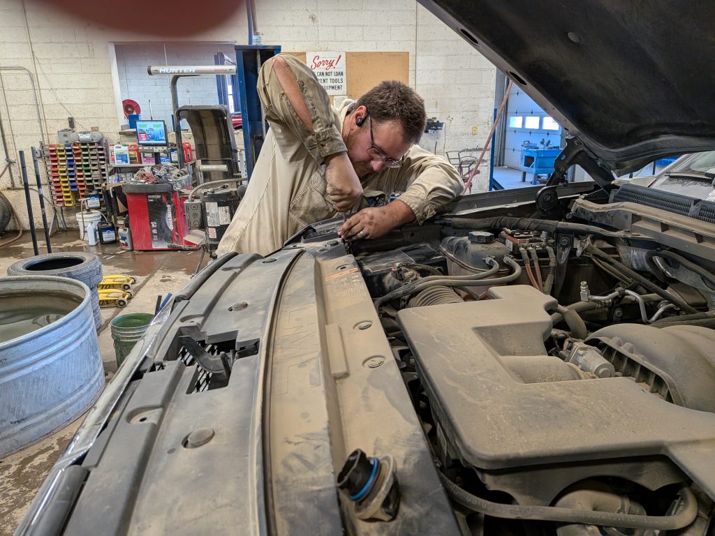 rusty working on an engine