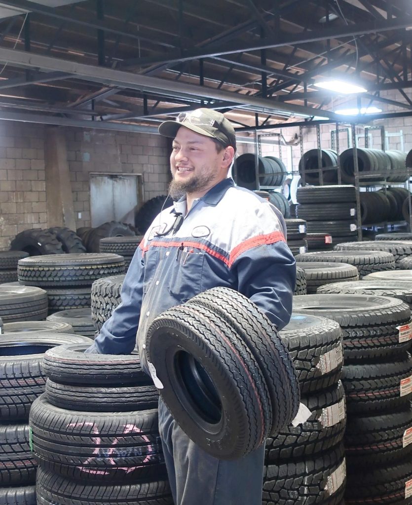 guy holding tire